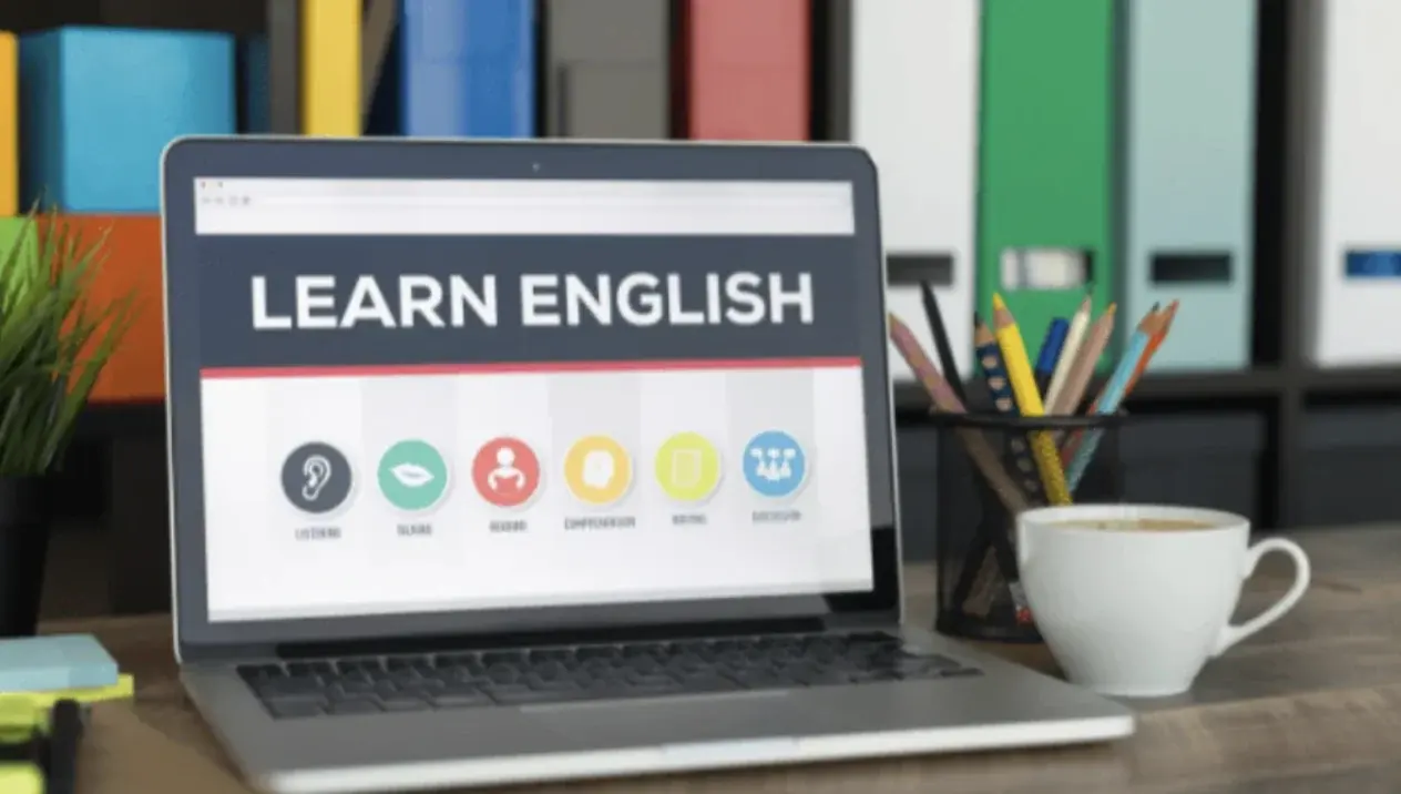 A laptop showing an online English lesson.